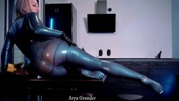sexy curvy MILF Arya Grander fetish model posing in latex rubber catsuit
